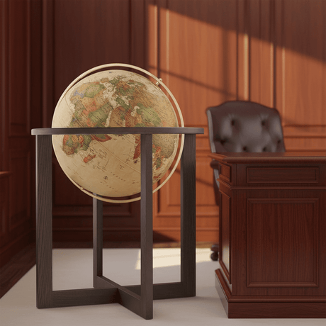 San Marino antique globe with wood stand placed near a mahogany desk in an office.
